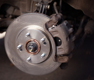 Showing old brake rotor during brake repair
