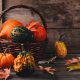 Festive pumpkin decorations in a basket